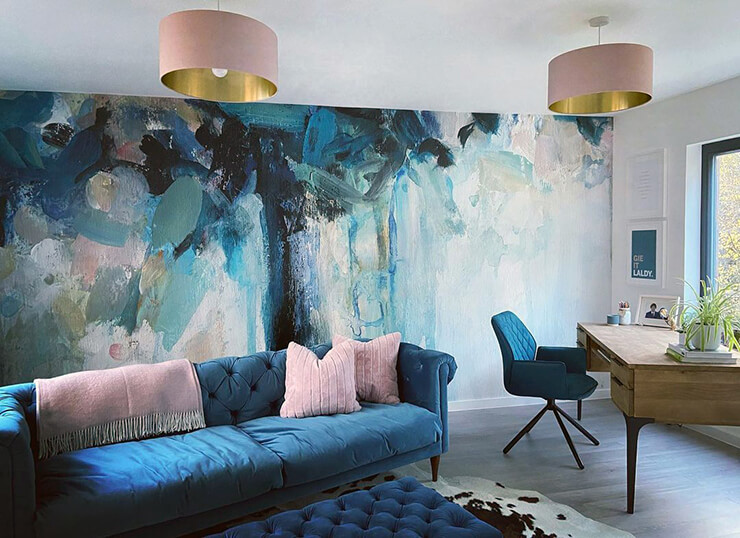 Blue floral wallpaper feature wall in multifunctional living room