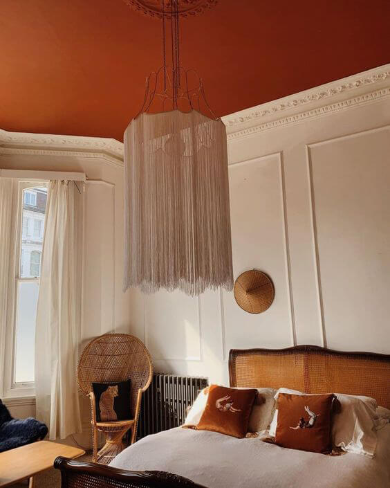 Terracotta colour scheme bedroom with painted ceiling