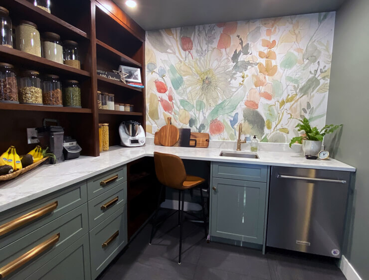 neutral toned floral wallpaper in dark grey and brass pantry