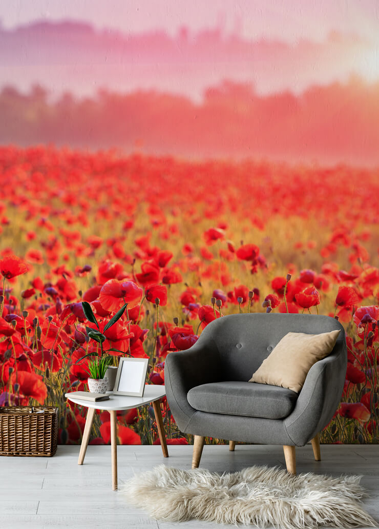 red poppy field wallpaper in living room with grey chair and sheep skin cushion