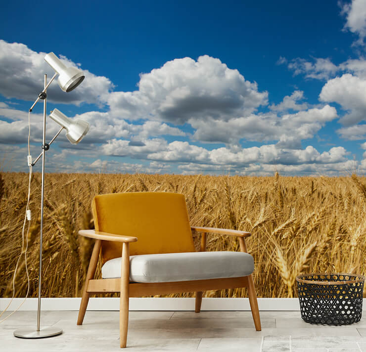 golden wheatfield wallpaper in lounge with mustard orange chair