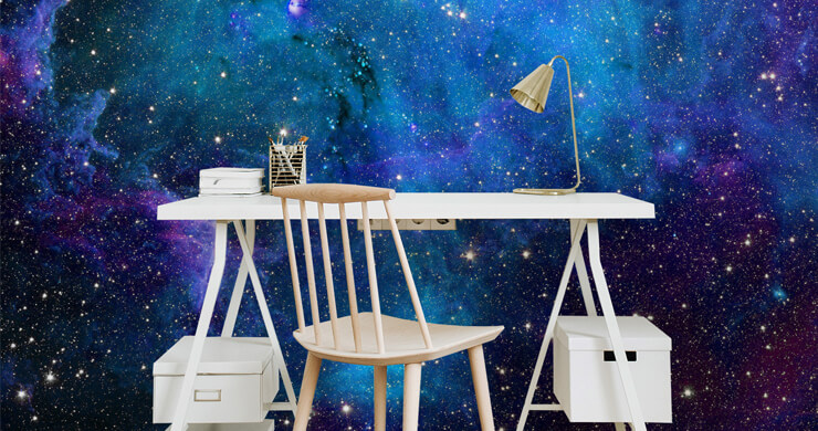 white desk area with colourful galaxy wallpaper
