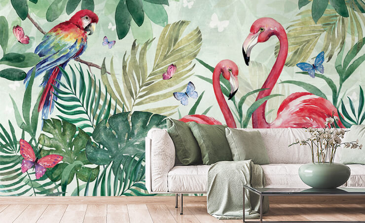 leafy green exotic wallpaper with flamingos in living room with green and off-white accessories