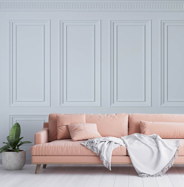 off white panel effect wallpaper in room with pink couch