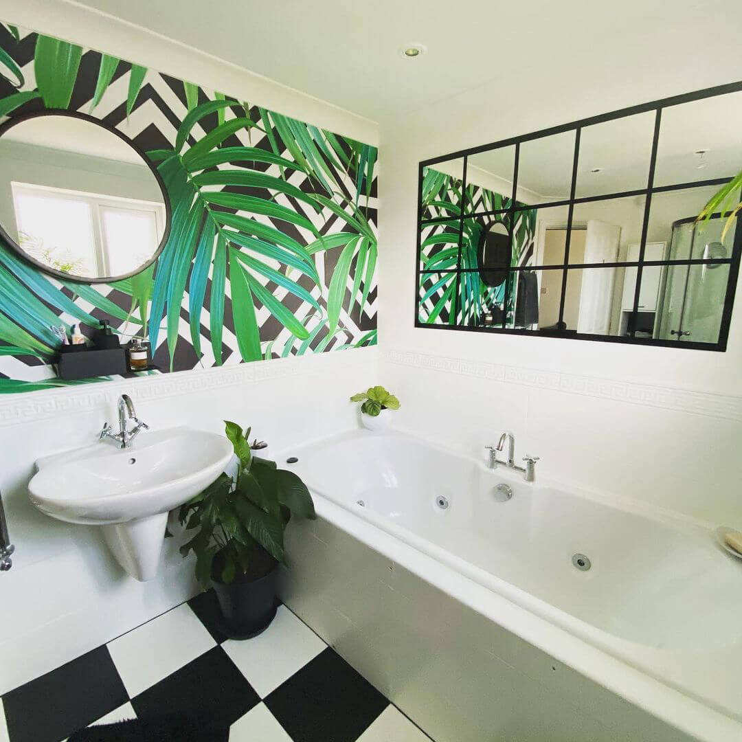 monochrome bathroom with palm leaf wallpaper