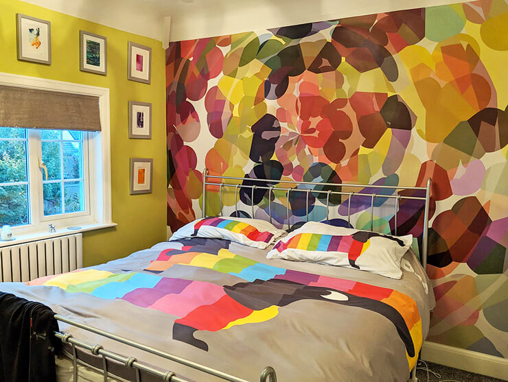abstract colourful shapes wallpaper in bedroom