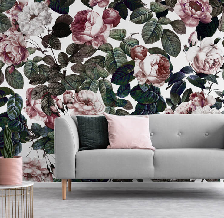 dusty pink rose wallpaper in living room with grey couch