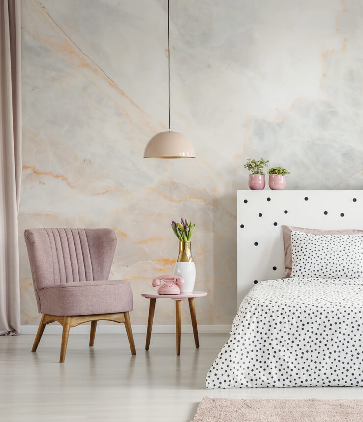 light pink and white marble wallpaper in dotty pink bedroom