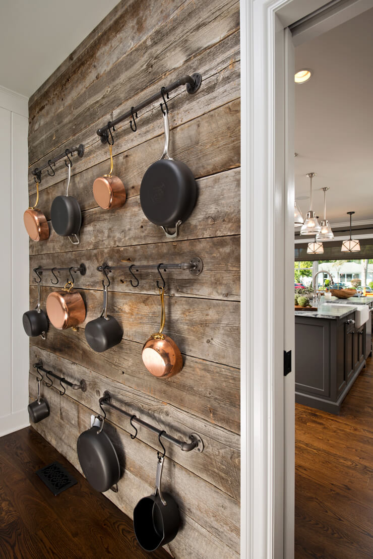 rustic wooden panels kitchen pan wall storage