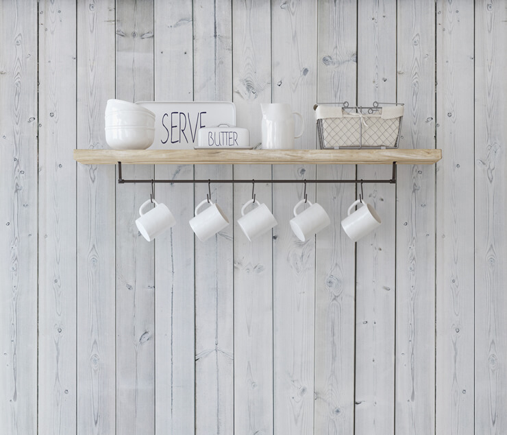 white wood effect wallpaper behind cup shelving