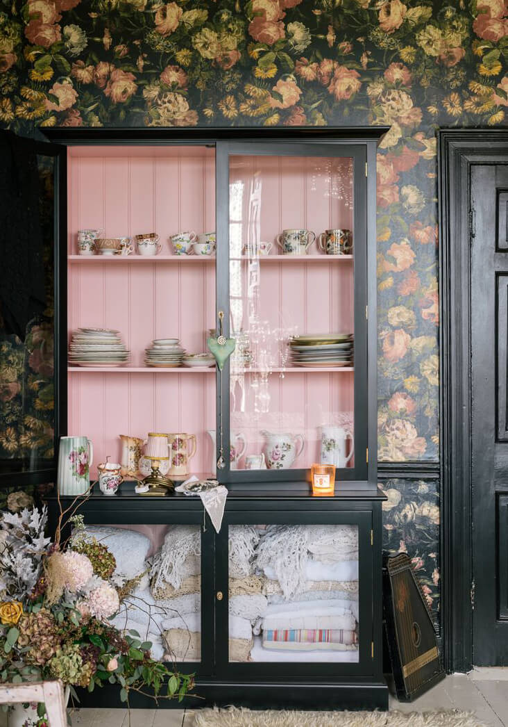 dark floral kitchen with cup storage