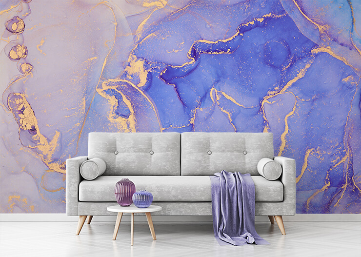 Purple marble effect mural with a grey sofa and purple accessories