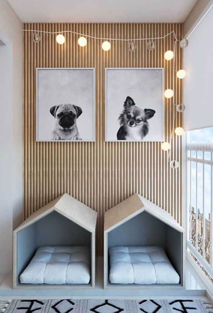 Two dog beds with lights and striped wallpaper