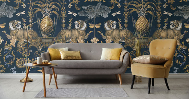 Interior styling 2023 trend idea of a gold and blue living room with gold and grey seating