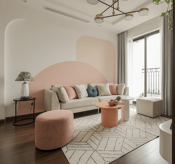 Cream and peach living room with curved furniture