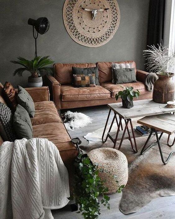 Beige and cream living room with a brown sofa and grey walls