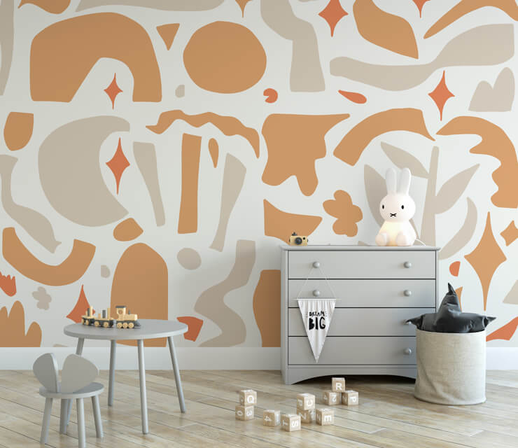 Orange and brown wall mural in a kids room with grey furniture