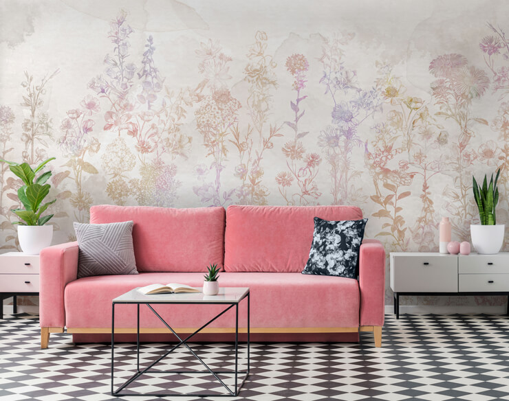 Pink sofa in a living room with a pink and purple watercolour wall mural