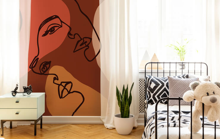 Abstract art-inspired wall mural in a bedroom with voile curtains and a metal framed bed