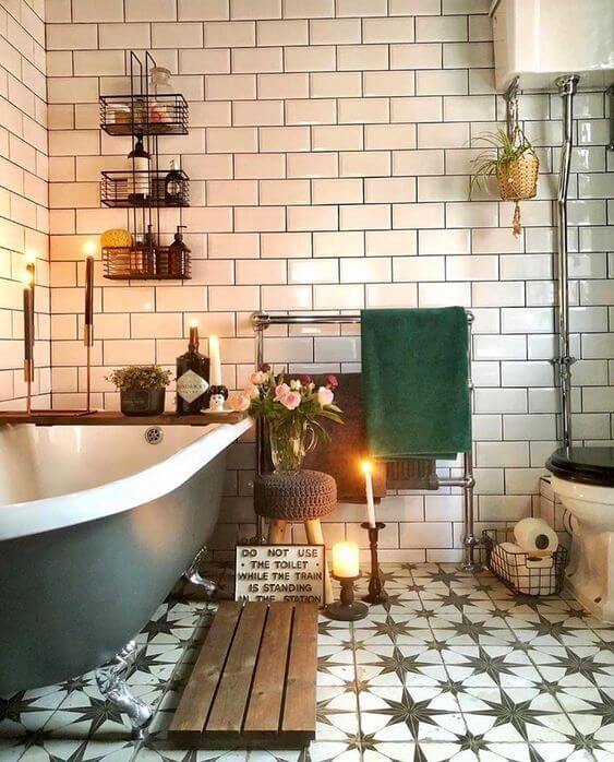 Bathroom with white tiles and patterned flooring with a mixture of metal and wooden accessories