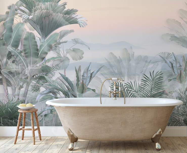 Rose gold bath in a bathroom with a muted green jungle wallpaper