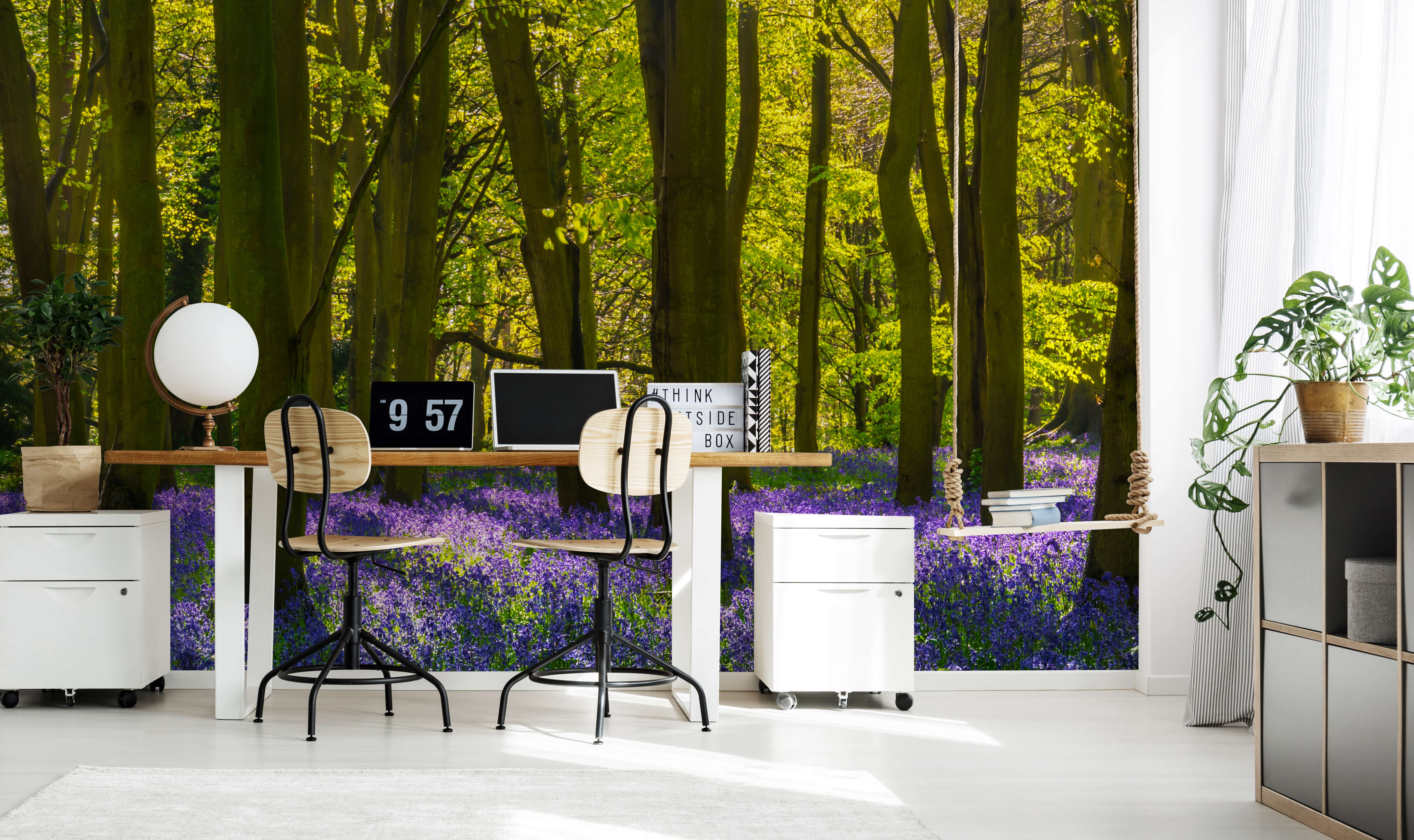 Spring wallpaper mural in a green woods with bluebell flowers in a living room with a grey sofa