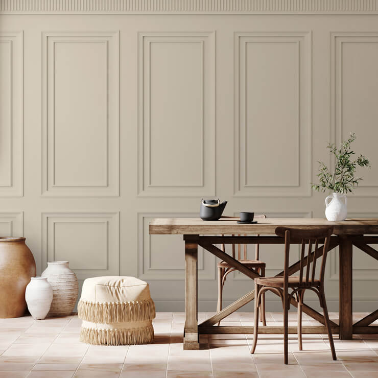 Cream neutral panel wallpaper ina dining room with a wooden table and chairs