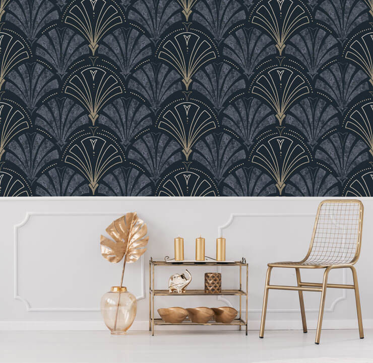 Navy and gold Art Deco wallpaper in a hallway with white wall panels and gold accessories