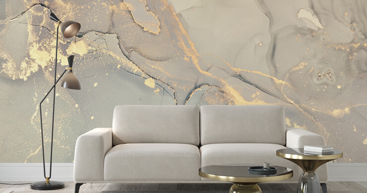 Stone grey marble effect wallpaper with a grey sofa and golden accents