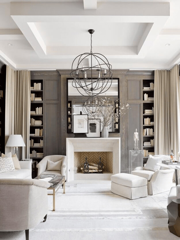 Black and white living room with a large black light hanging above