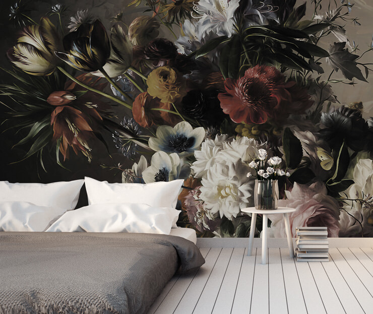 dark floral wallpaper in bedroom with grey bed