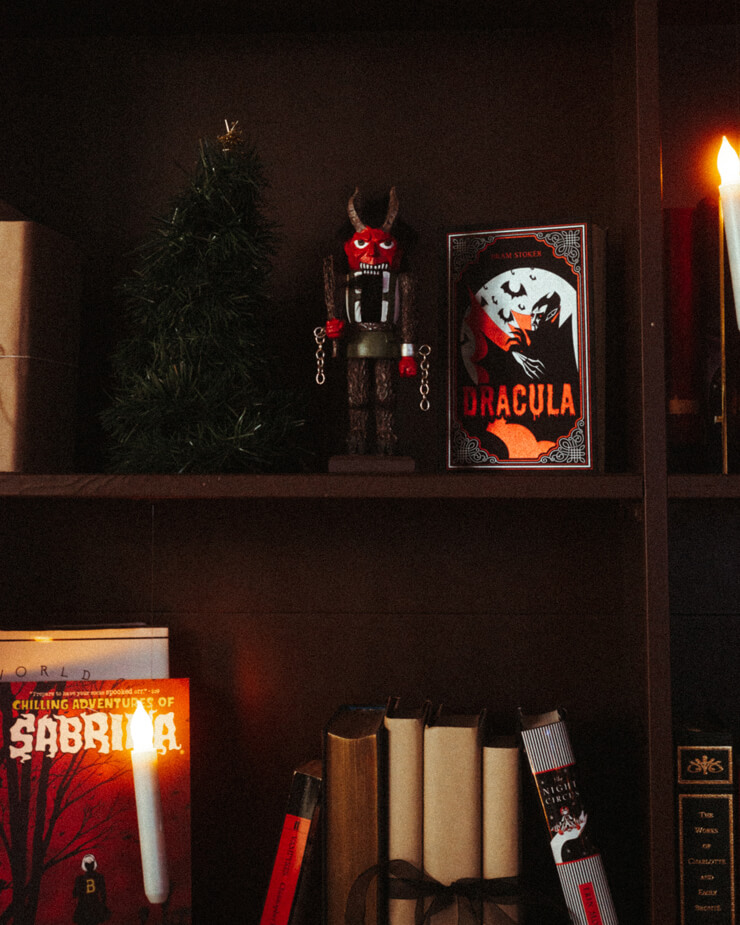 Ways to style your bookshelves with gothic books and candles with horror genre ornaments