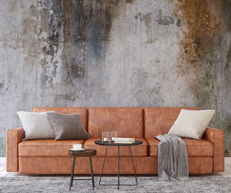 concrete mural in living room with leather sofa