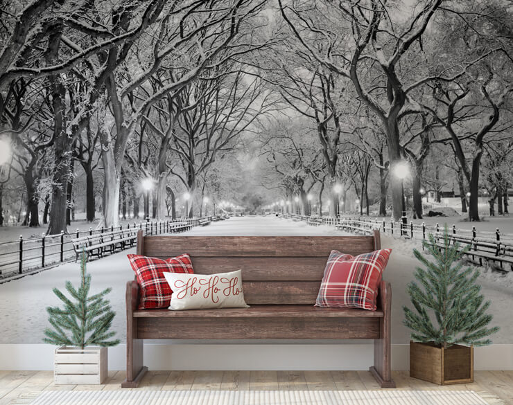 Christmas trees for small spaces in a hallway with a wooden bench and central park covered in snow wallpaper