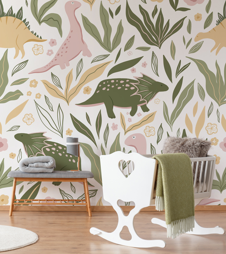pink and green dinosaur mural in nursery