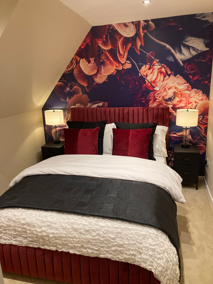 black and red floral wall mural in a bedroom black and red floral wall mural in a bedroom