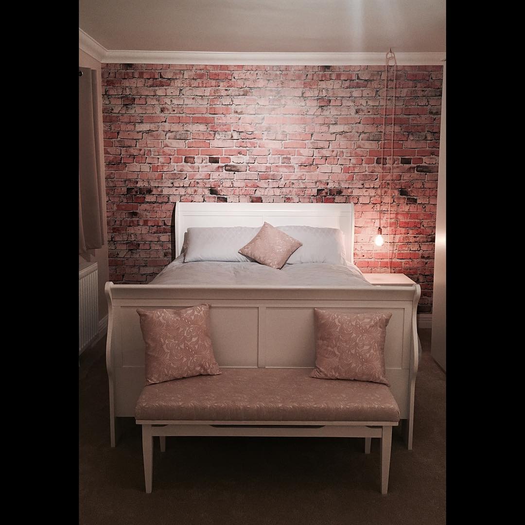 faux brick wall wallpaper in bedroom