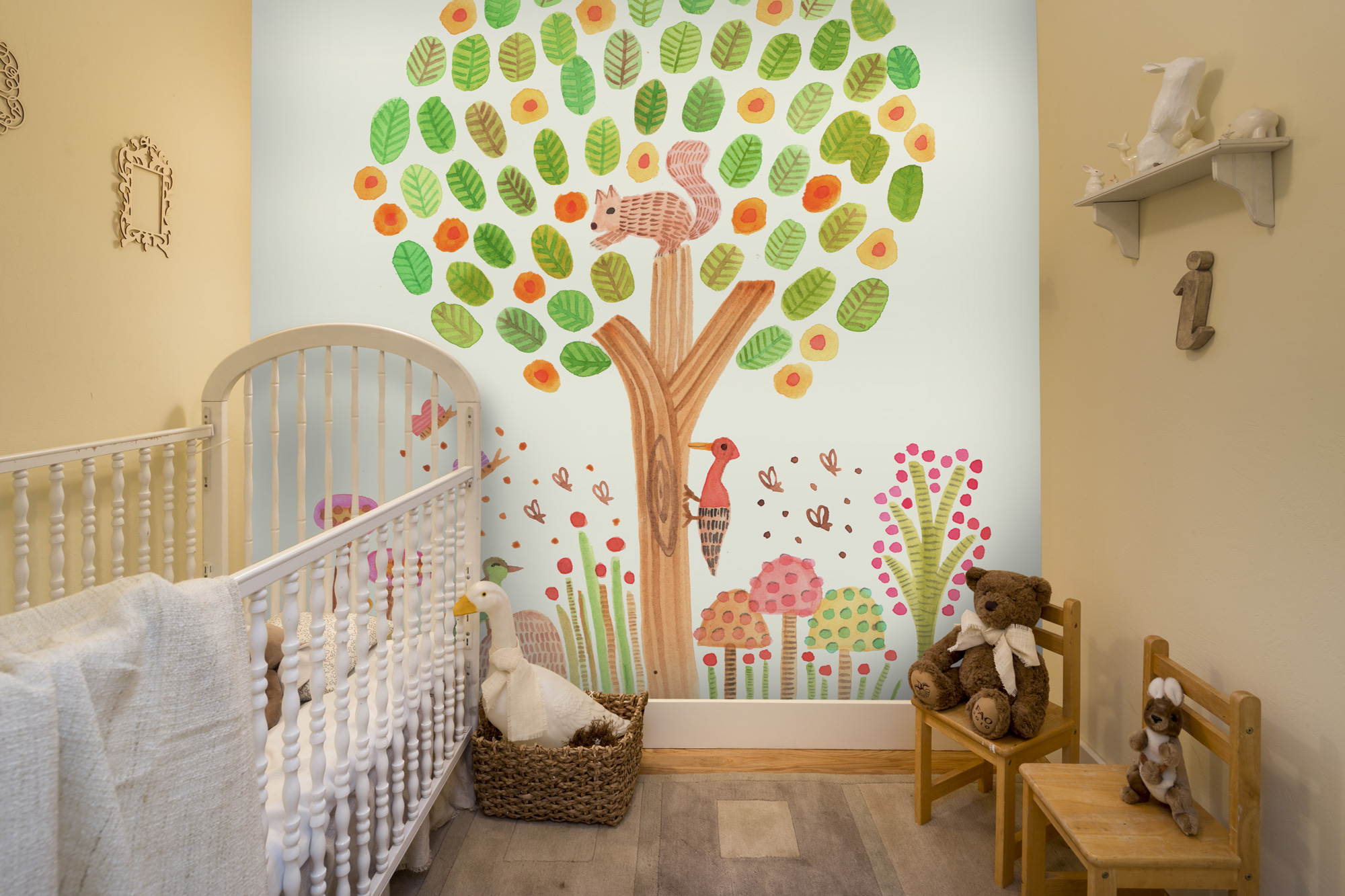 painting of tree and animals wallpaper in nursery
