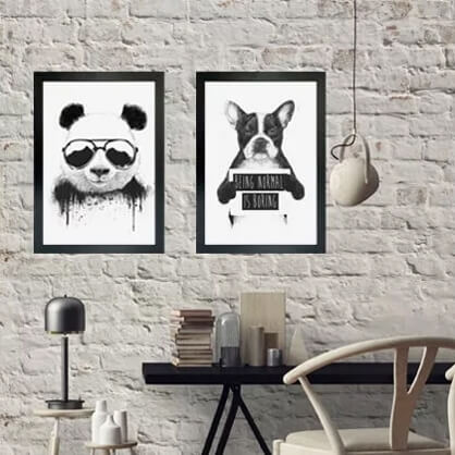 black and white framed prints in study