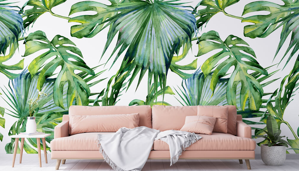 green palm leaf wallpaper with pink couch