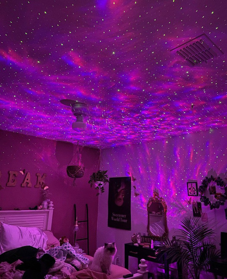 purple galaxy light projector in teenager's room