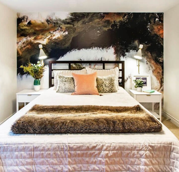 brown and off-white marble wallpaper in designer bedroom with pretty bed with fur blanket