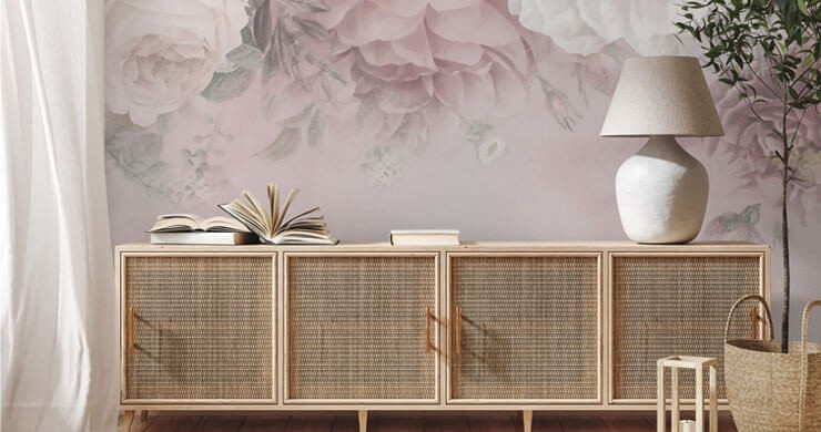 Rattan trend in a room with a rattan unit and rug, with a large, pink floral wallpaper and white voile curtains