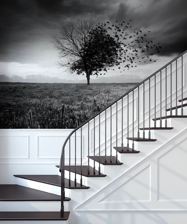 Black and white staircase with a black and white tree mural