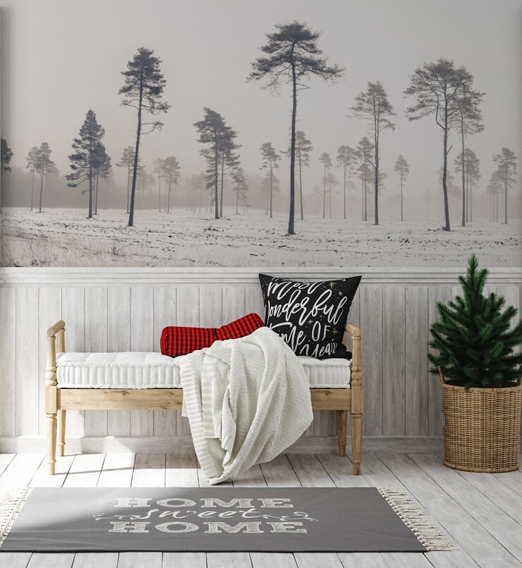 black and white snowy trees in field wallpaper in scandi hallway
