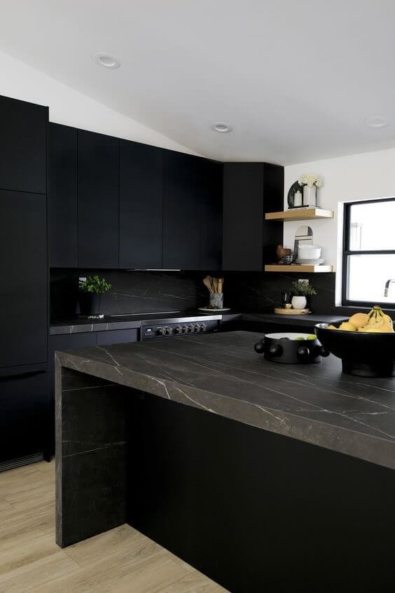 Black kitchen trends 2023 with black cupboards and walls