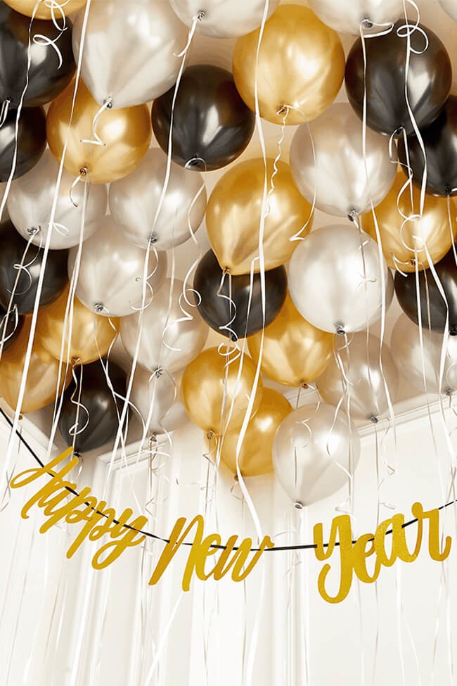 New Year's eve party ideas for gold and black balloon drops