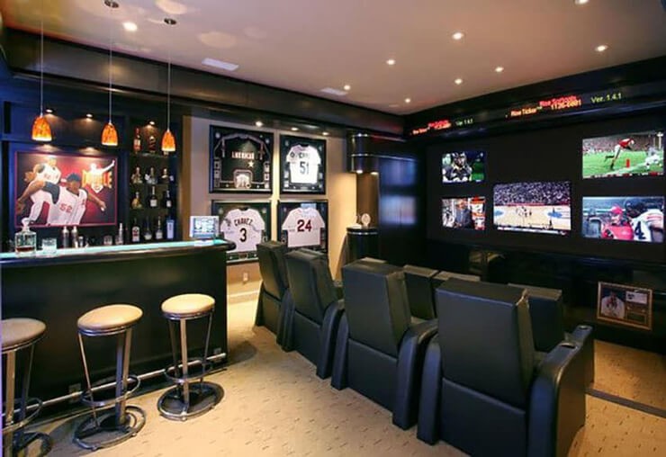 sports room with movie screen and bar