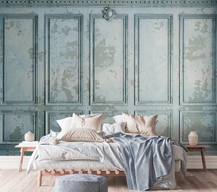 vintage style duck egg blue panel wallpaper in bedroom with wooden bed and white and grey bedding