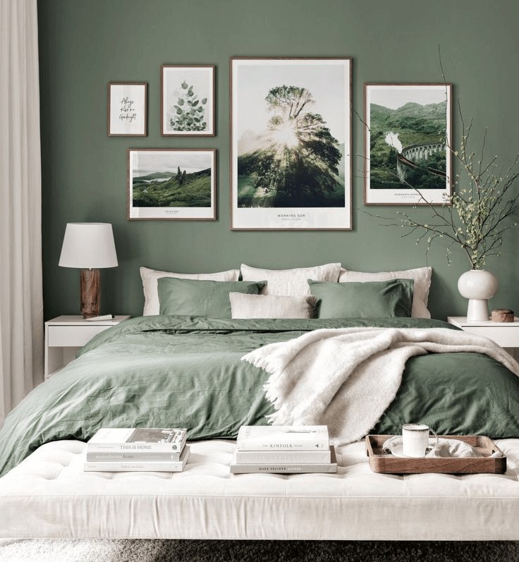 sage green and white bedroom with wall gallery